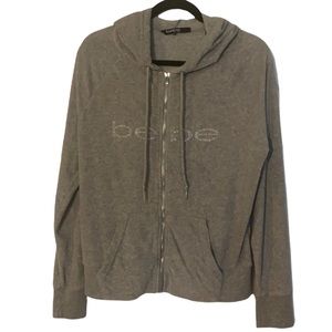 Bebe size (m) grey terry cloth hoodie with rhinestone logo on chest.